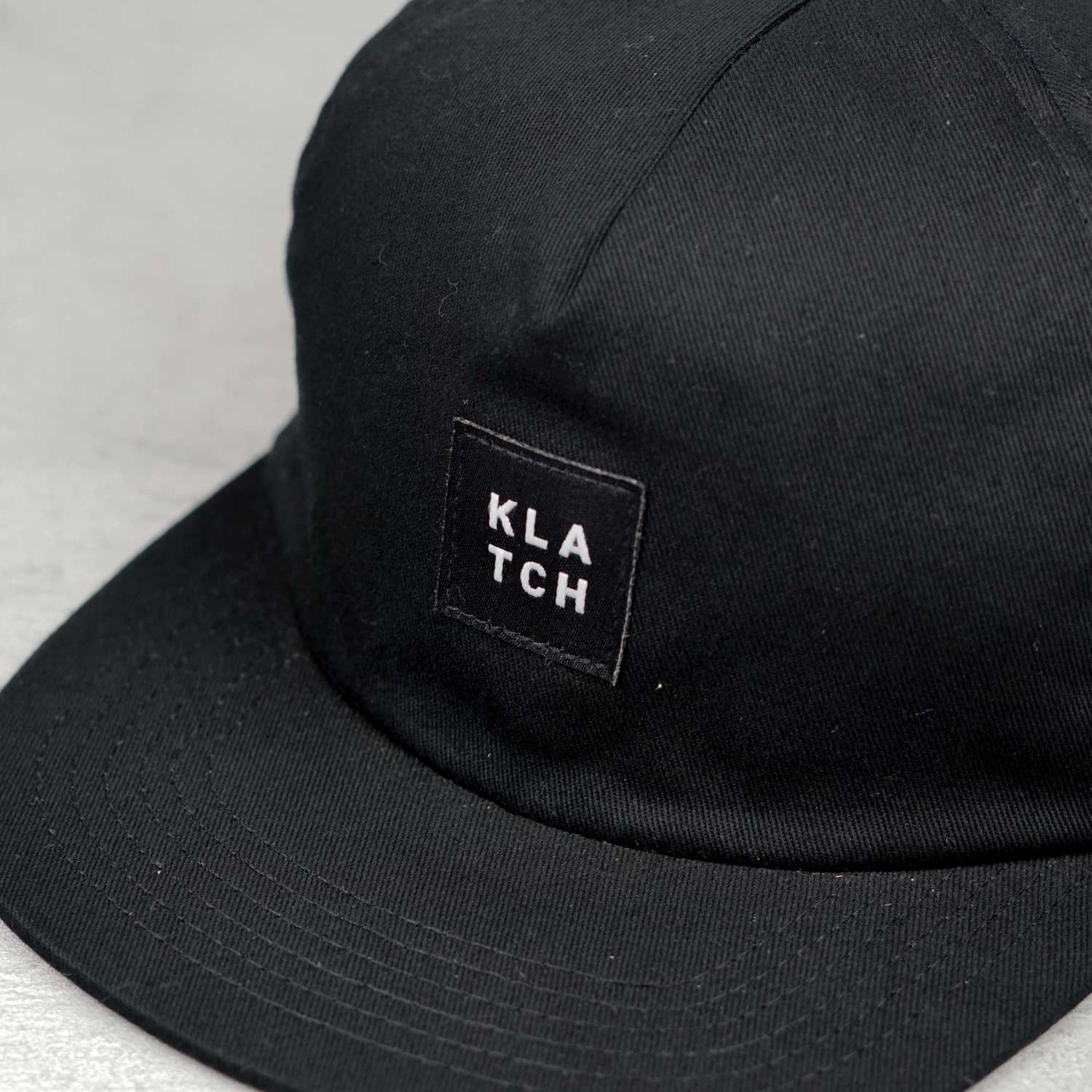 woven label on black snapback cap