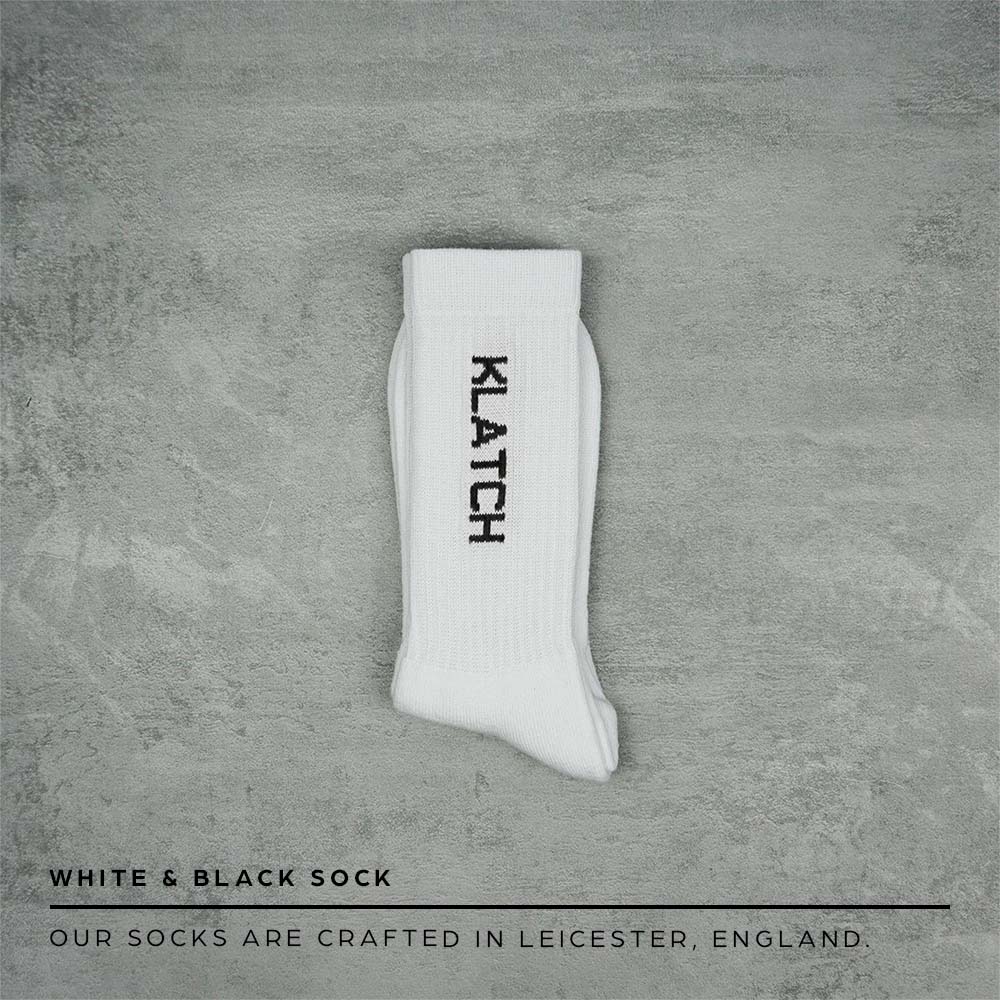 white & black text socks folded